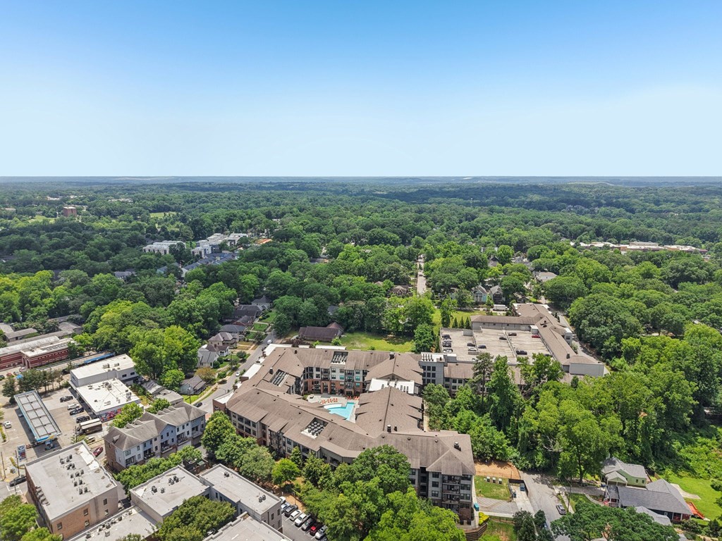 A bird's eye view of a residential area with houses and trees.